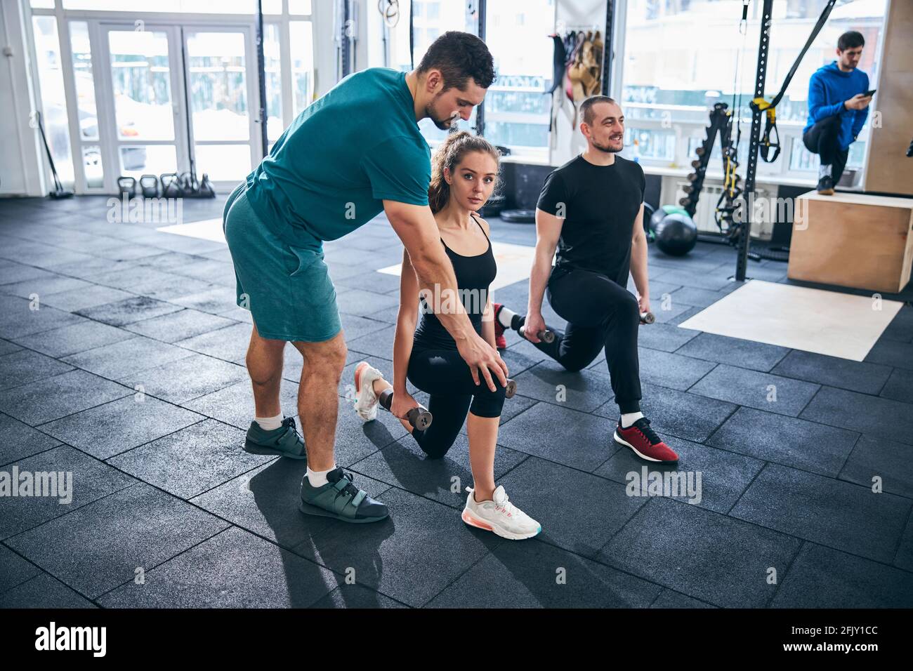 Fitness Partners Exercising Together And Doing Pushups High Five