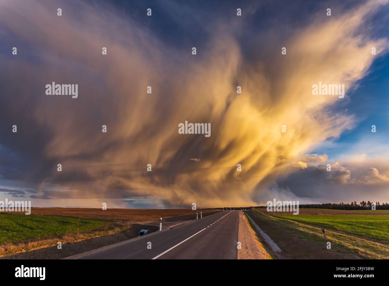 Mammatus clouds at sunset, dramatic storm clouds Stock Photo
