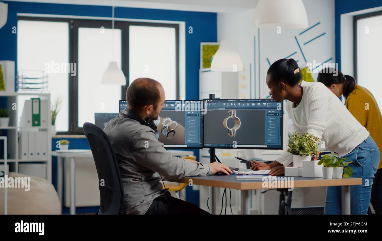 Professional heavy industry team of engineers working on computer with ...