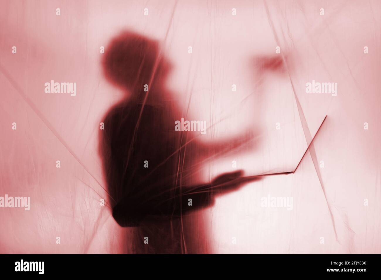 Anonymous Hacker commits computer crime Stock Photo