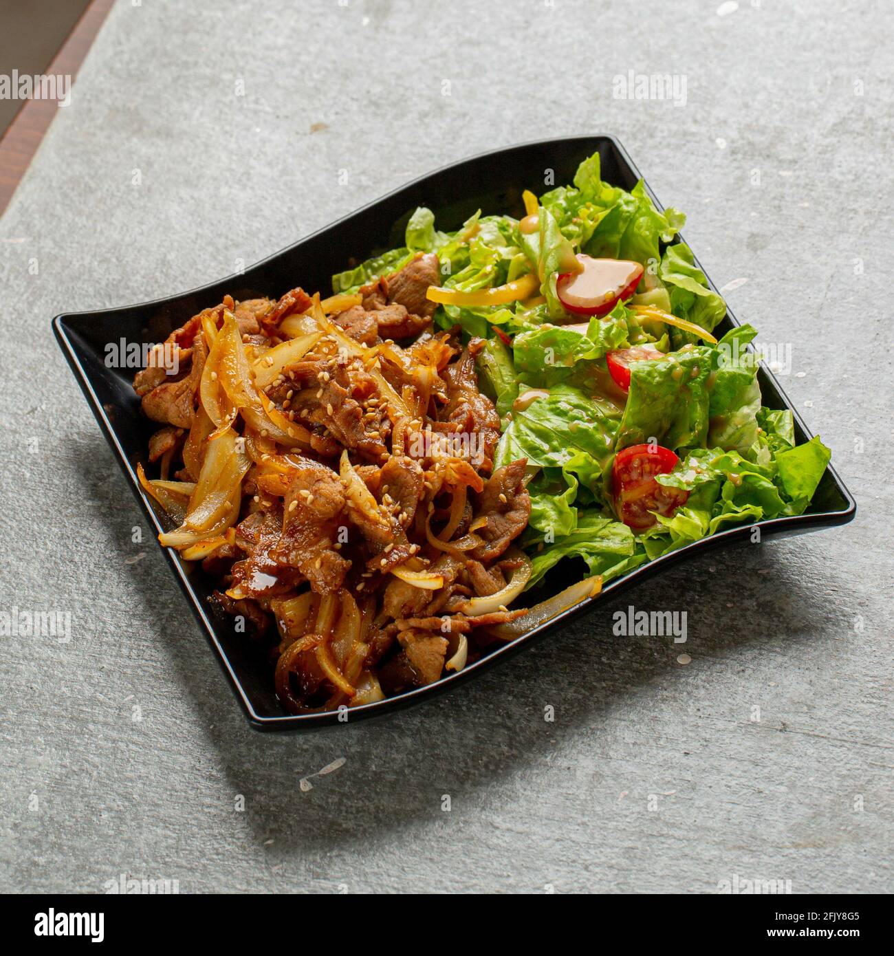Vertical shot of delicious wok noodles with salad Stock Photo Alamy