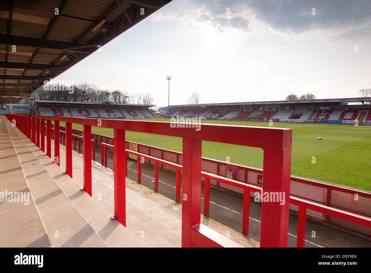 Empty football terrace looking out onto pitch at lower league ground, Lamex Stadium, home of Stevenage FC Stock Photo