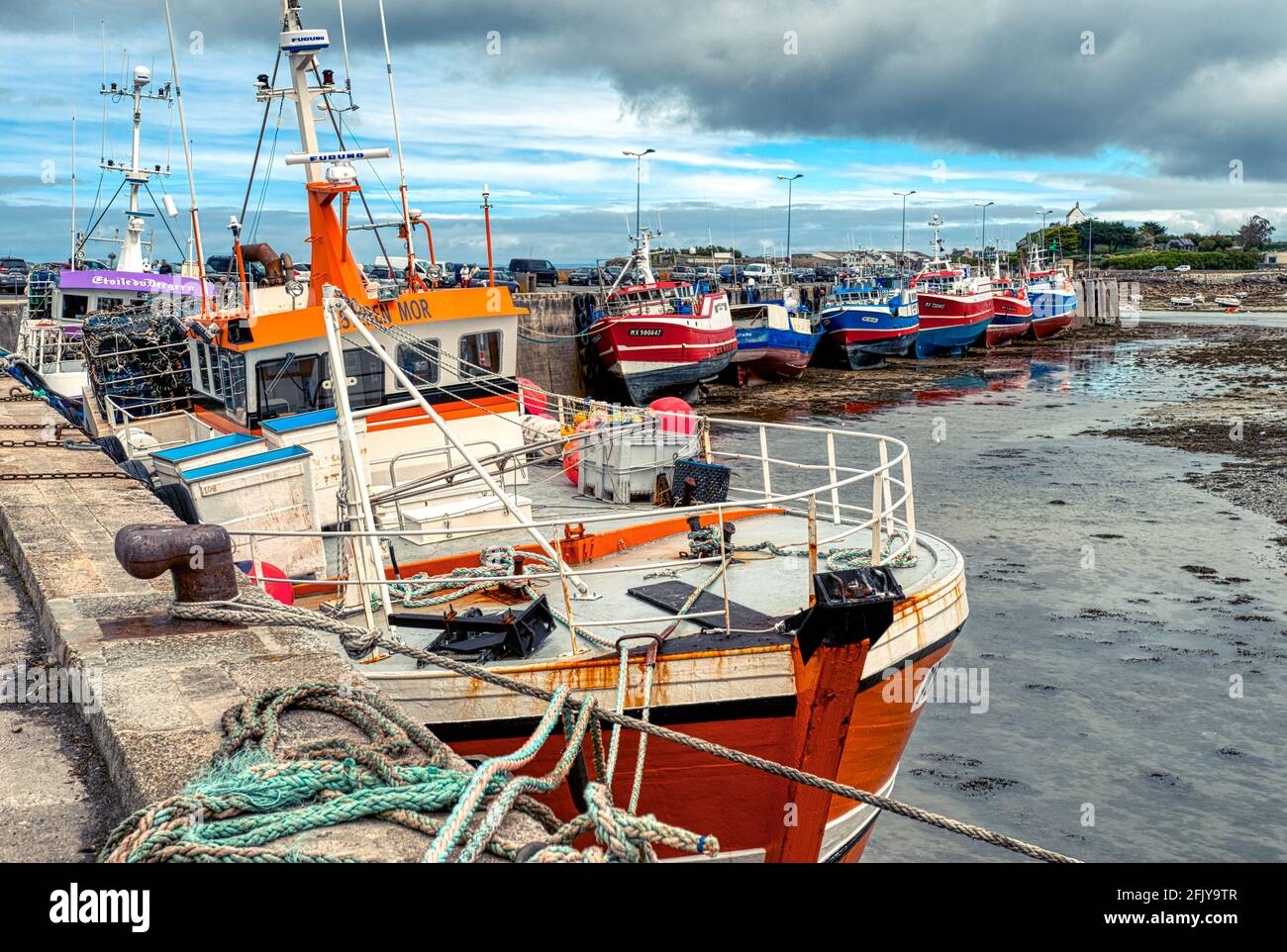 Fishing trawler at low tide in the port of Roscoff Stock Photo
