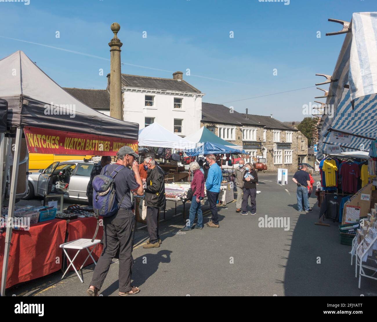 Shoppers in the the outdoor street market in Settle, Yorkshire, England, UK Stock Photo