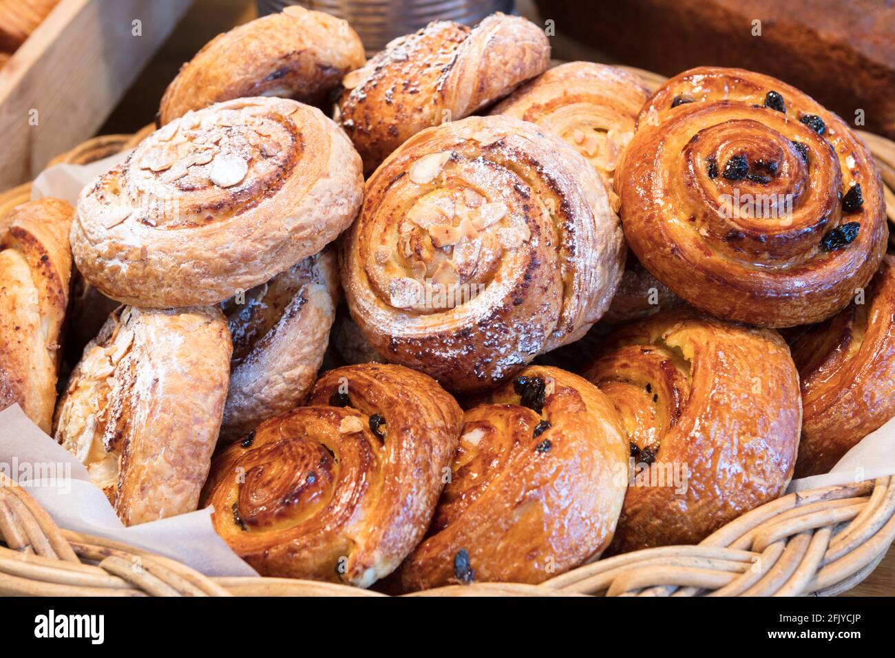 Basket of freshly baked Danish pastries in bakery Stock Photo Alamy