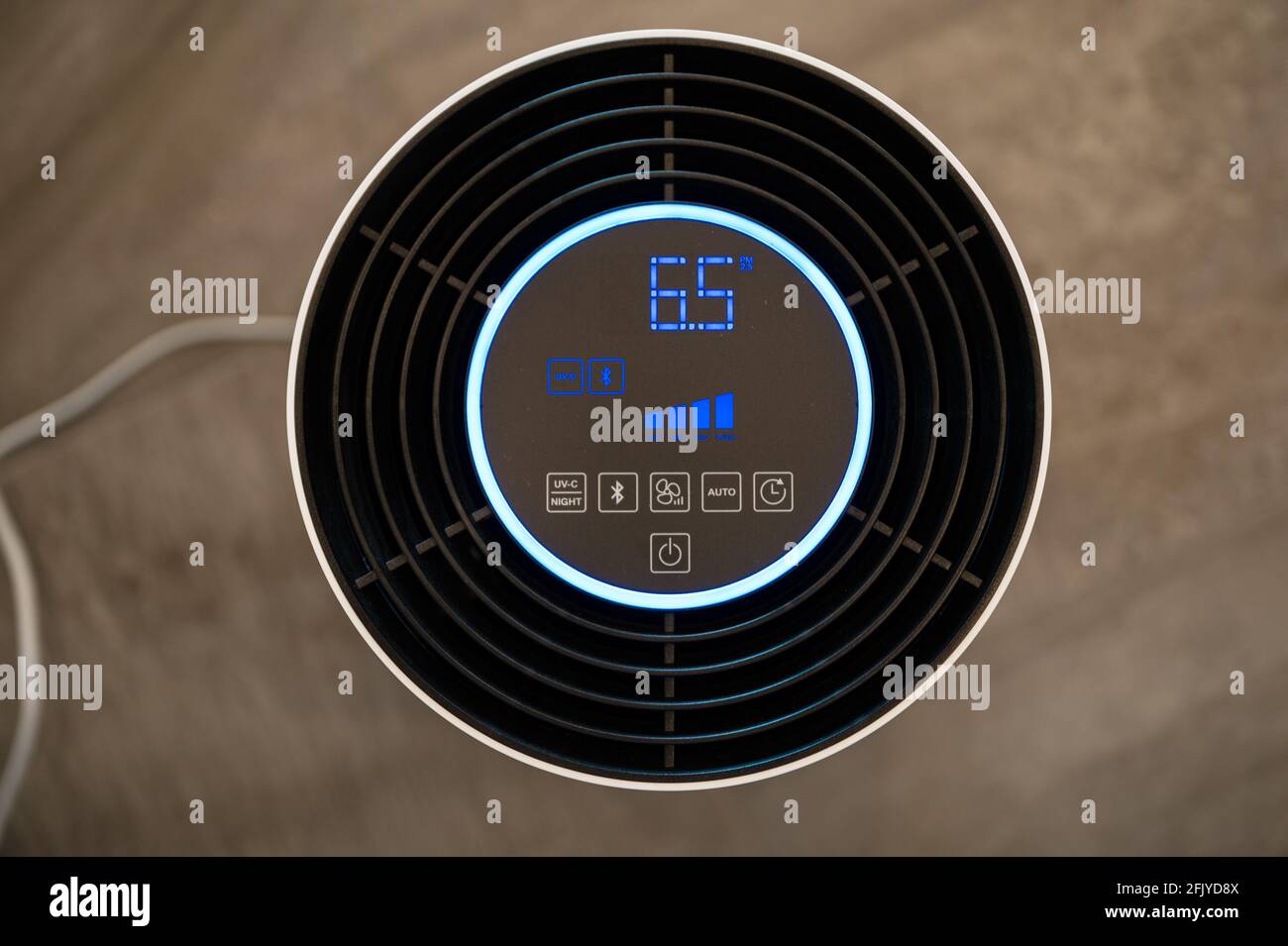 White UVC air purifier filters viruses and pollutants from indoor air