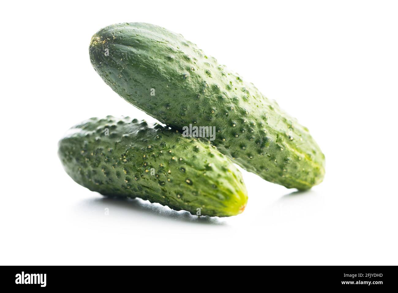 Fresh green cucumbers isolated on white background. Stock Photo