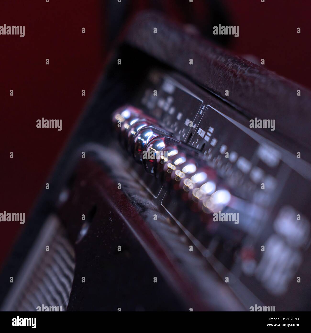 Knobs for volume, tone and various settings on the guitar amp. Guitar combo. Close up. Selective focus Stock Photo