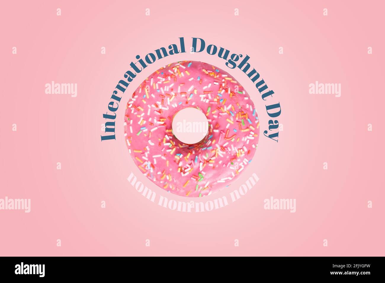 International doughnut day card. Pink doughnut with icing and confetti in center of poster. Text nom nom nom around donut.  Stock Photo