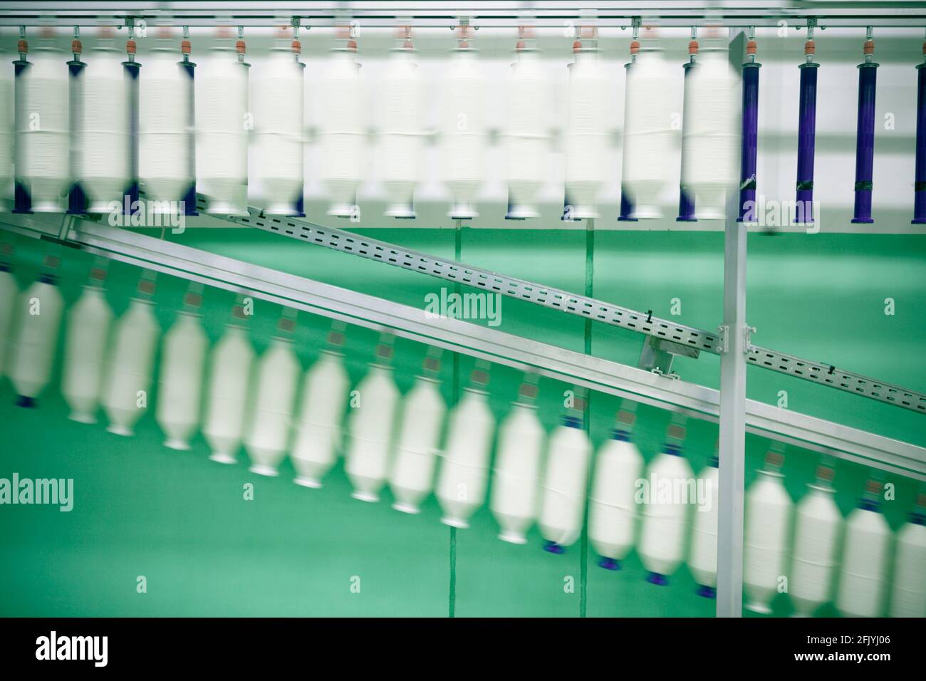 Cotton rolling in a cotton sorter and Cleaner in a yarn spinning unit in textile mill. Stock Photo