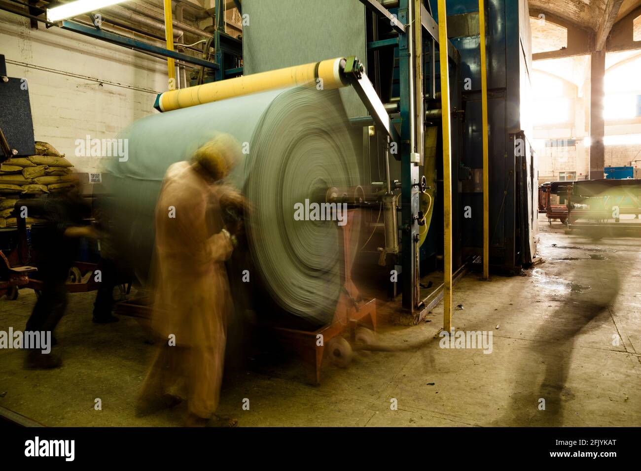 denim getting steamed press in rolls for finishing in denim manufacturing industry 2FJYKAT