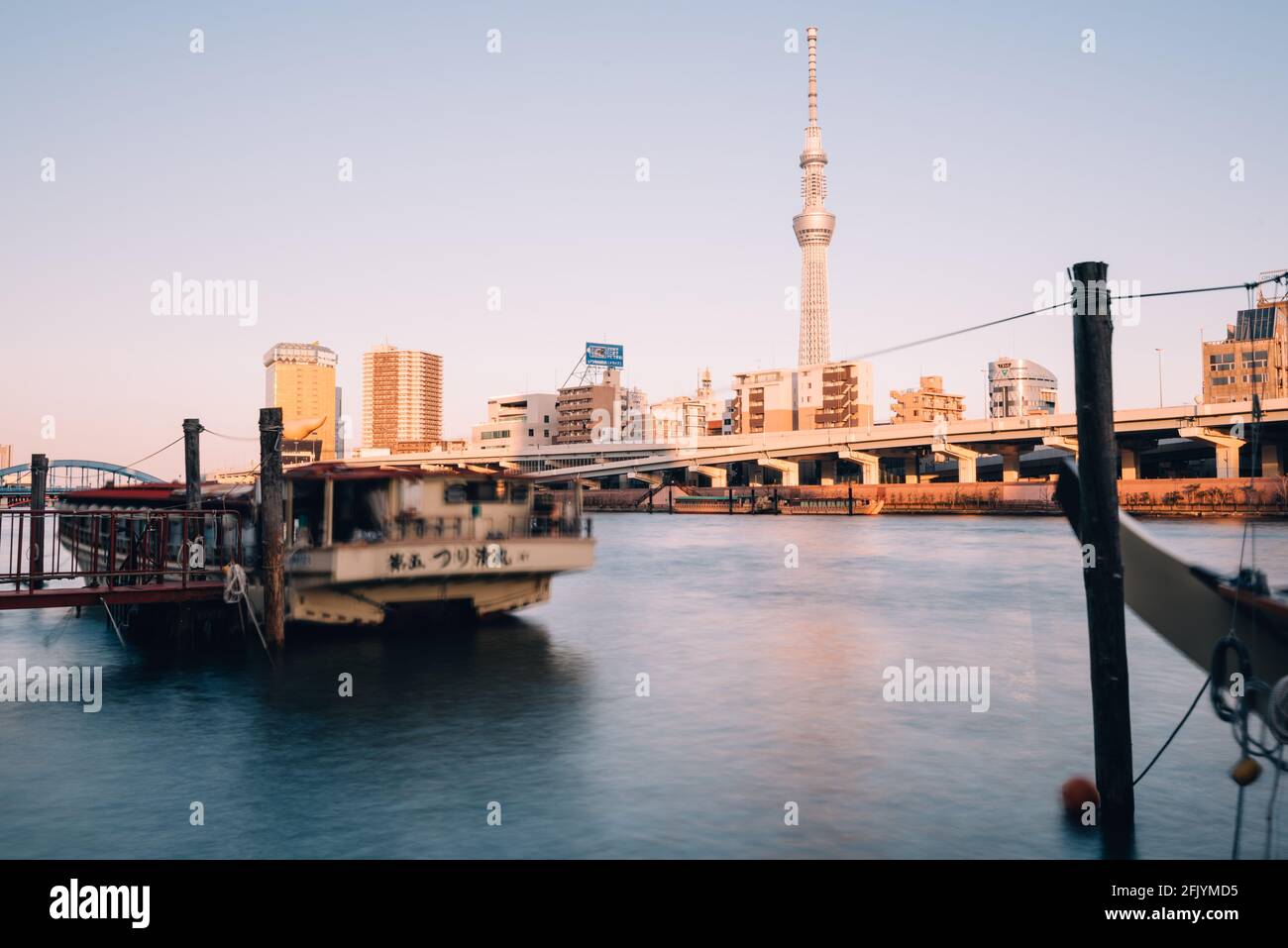 Tokyo, Japan - December 12, 2015: Tokyo Skytree and Sumida River, Tokyo, Japan. Tokyo Skytree at 634m, is the tallest free-standing broadcasting tower Stock Photo