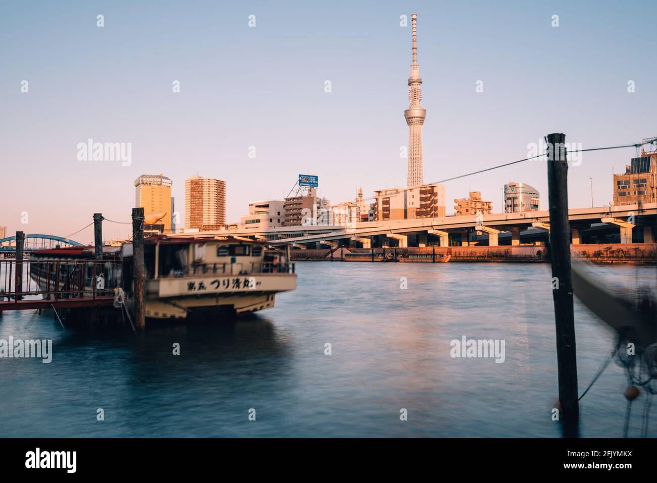 Tokyo, Japan - December 12, 2015: Tokyo Skytree and Sumida River, Tokyo, Japan. Tokyo Skytree at 634m, is the tallest free-standing broadcasting tower Stock Photo