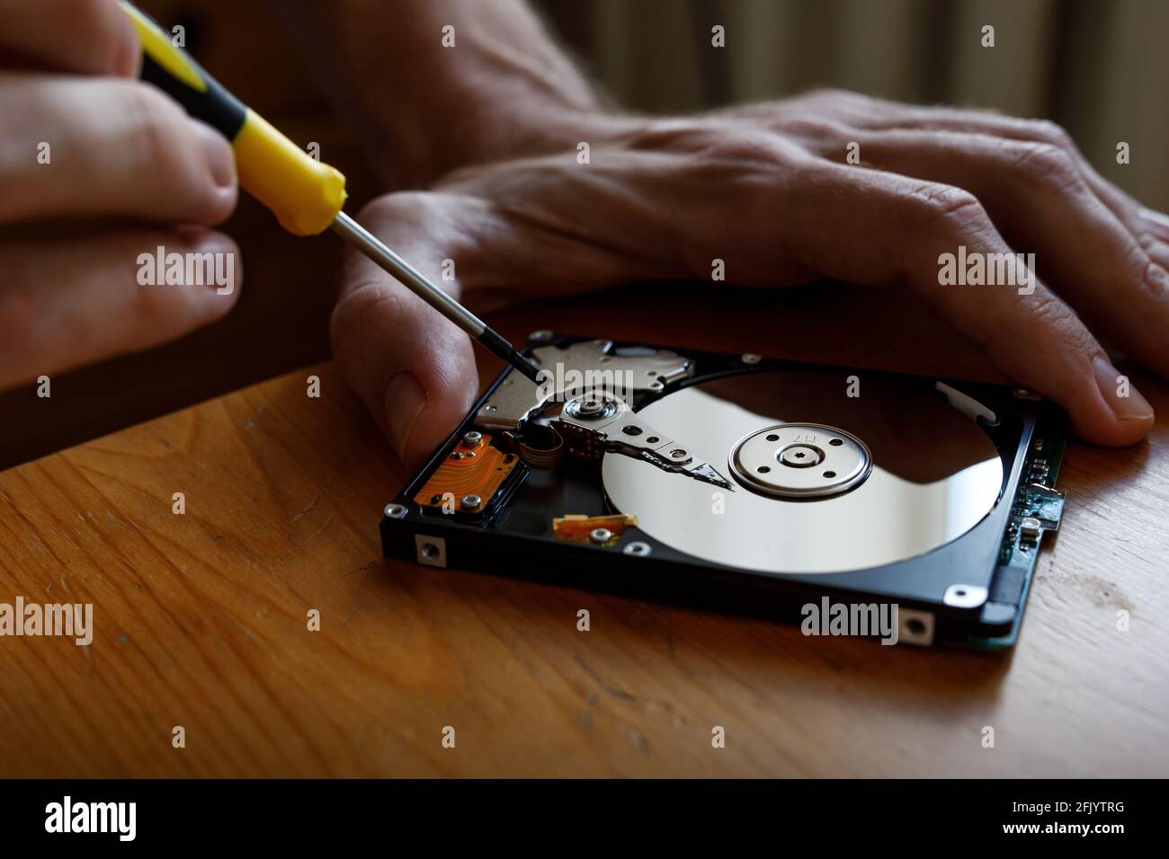 An HDD, hard disk drive repair and renovation concept. Repairman recover  data information from broken hdd Stock Photo - Alamy