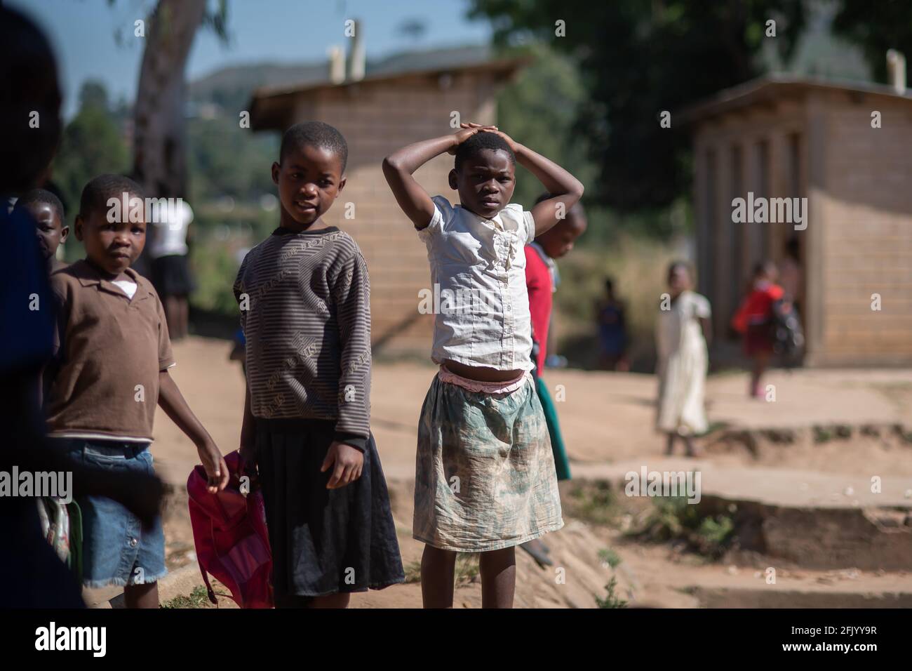 Mzuzu, Malawi. 30-05-2018. Group of black children gather in front of the camera after finishing school in a rural area of Malawi. Stock Photo