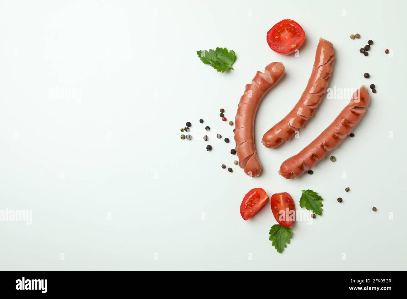 Grilled sausage and spices on white background Stock Photo