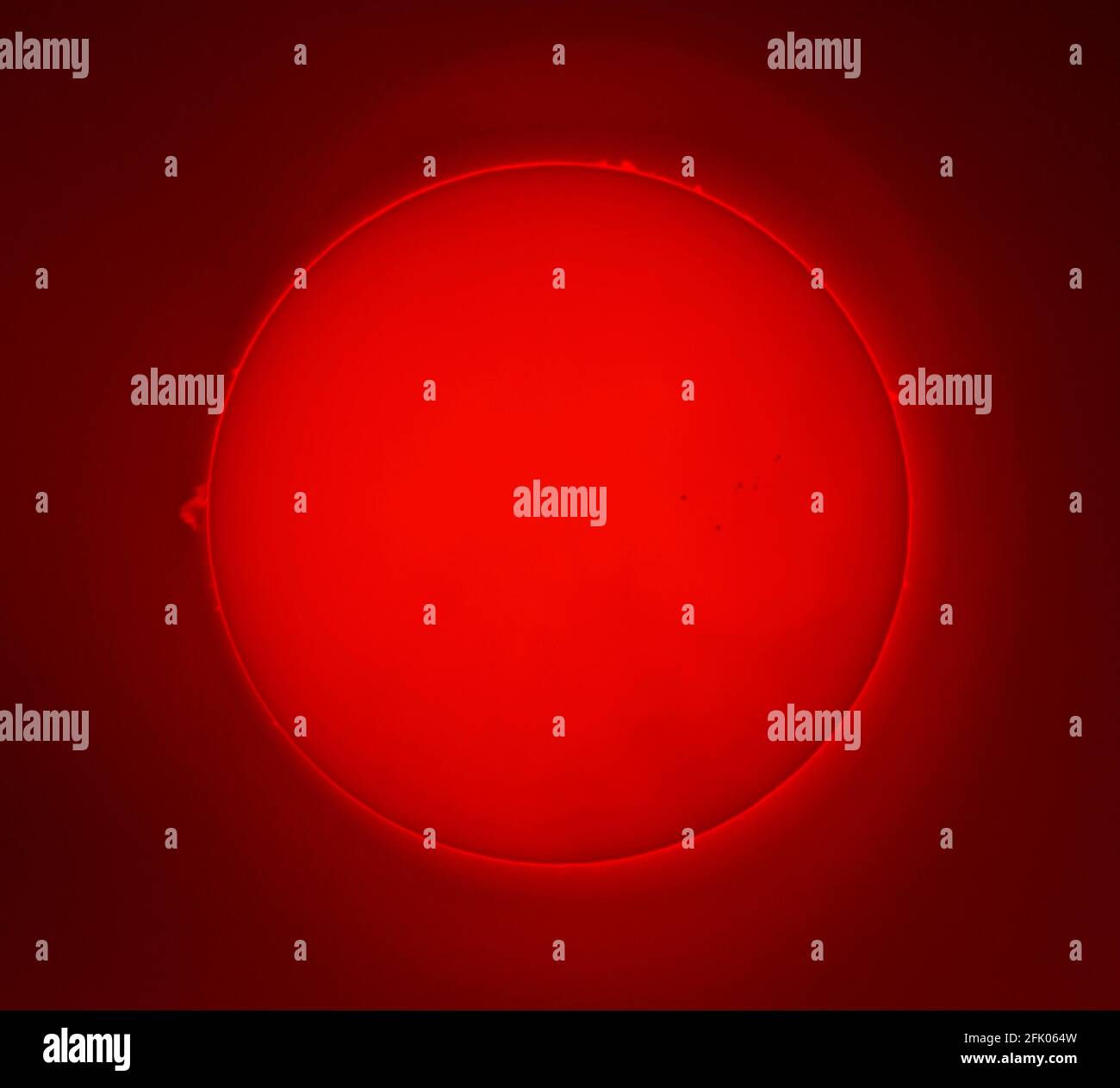 Wimbledon, London, UK. 27 April 2021. Composite images of the Sun with prominences leaping from the edge and sunspot groups on the surface. Credit: Malcolm Park/Alamy Live News. Stock Photo