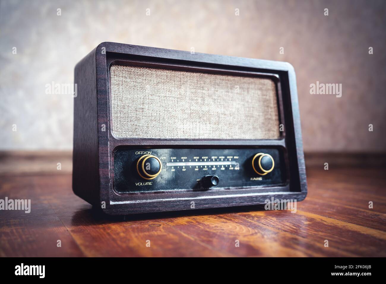 Retro radio. Old vintage music player in 60s style. Dusty receiver, speaker and boombox. Technology nostalgia. Knobs and frequency tuner. Stock Photo