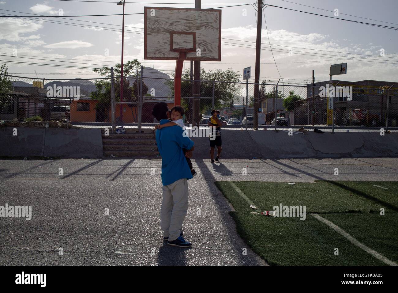 Juarez, Mexico. 26th Apr, 2021. Hundreds of men and women accompanied by their children are deported every day by the Paso del Norte International bridge in Ciudad Juárez Chihuahua and taken to the city's shelters, the children play in the courtyard of the shelter awaiting the request for political asylum in United States. (Photo by David Peinado/Pacific Press) Credit: Pacific Press Media Production Corp./Alamy Live News Stock Photo