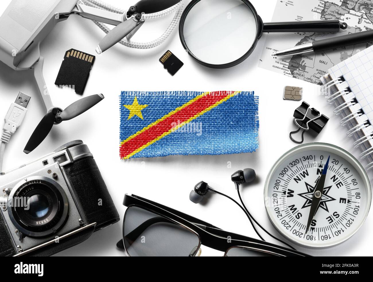 Flag of Democratic Republic of the Congo and travel accessories on a white background. Stock Photo