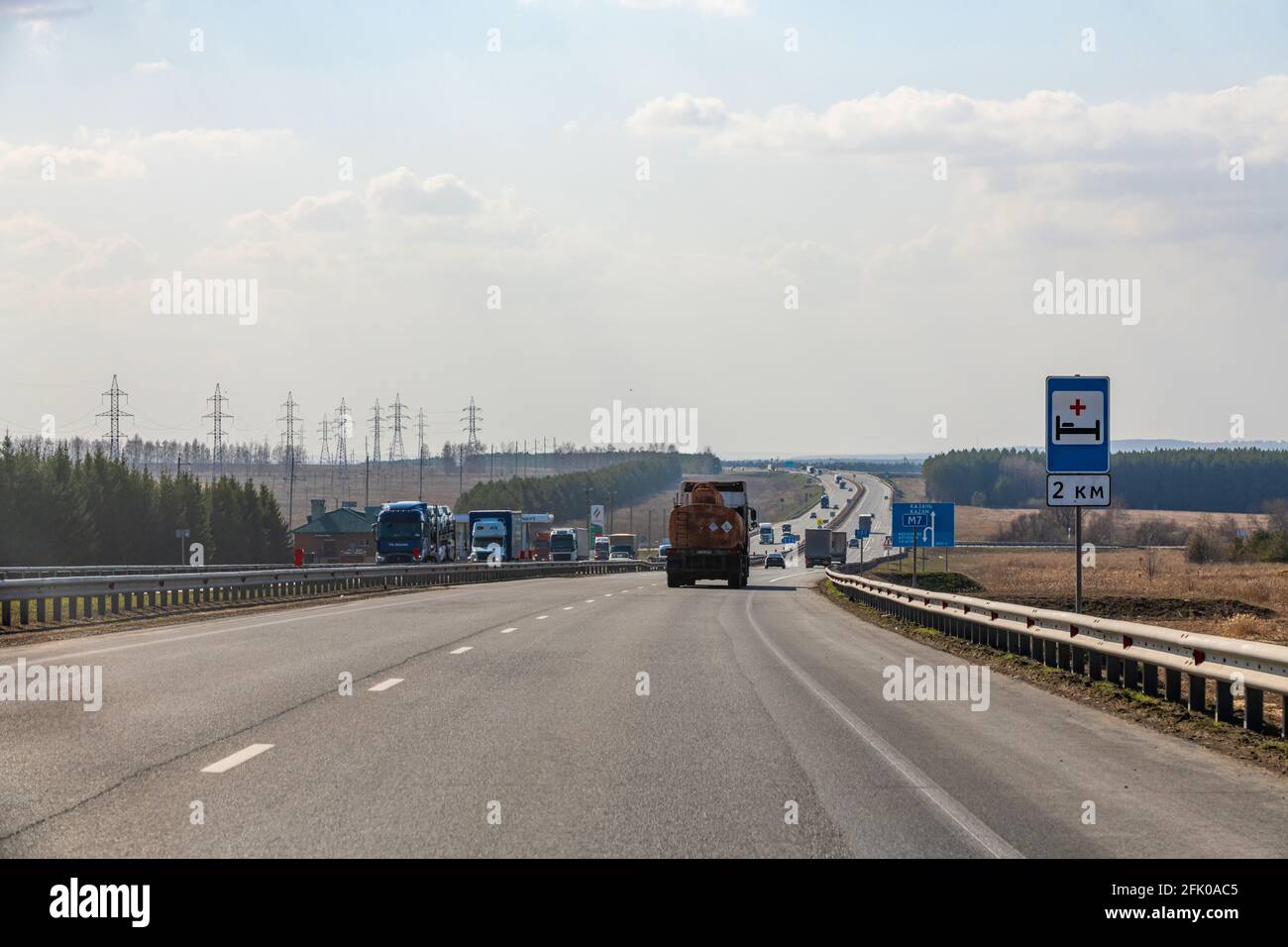 Interstate Highway Ufa - Kazan M7, Russia - Apr 23th 2021. Truck move along the federal highway to their destination. A pointer to the hospital after Stock Photo