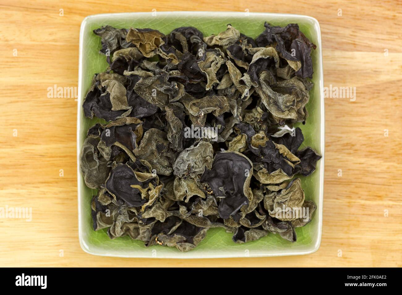 Dried Chinese edible black fungus, called Jew's Ear Mushroom in green
