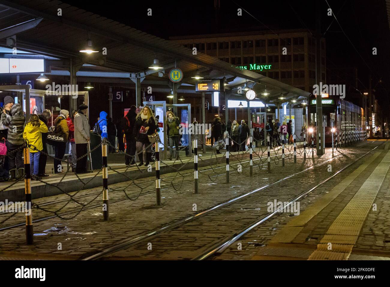 Freiburg, Germany - December 25, 2014: People waiting for a strassenbahn ( german word for tram ) in a station in Freiburg, Germany. Stock Photo