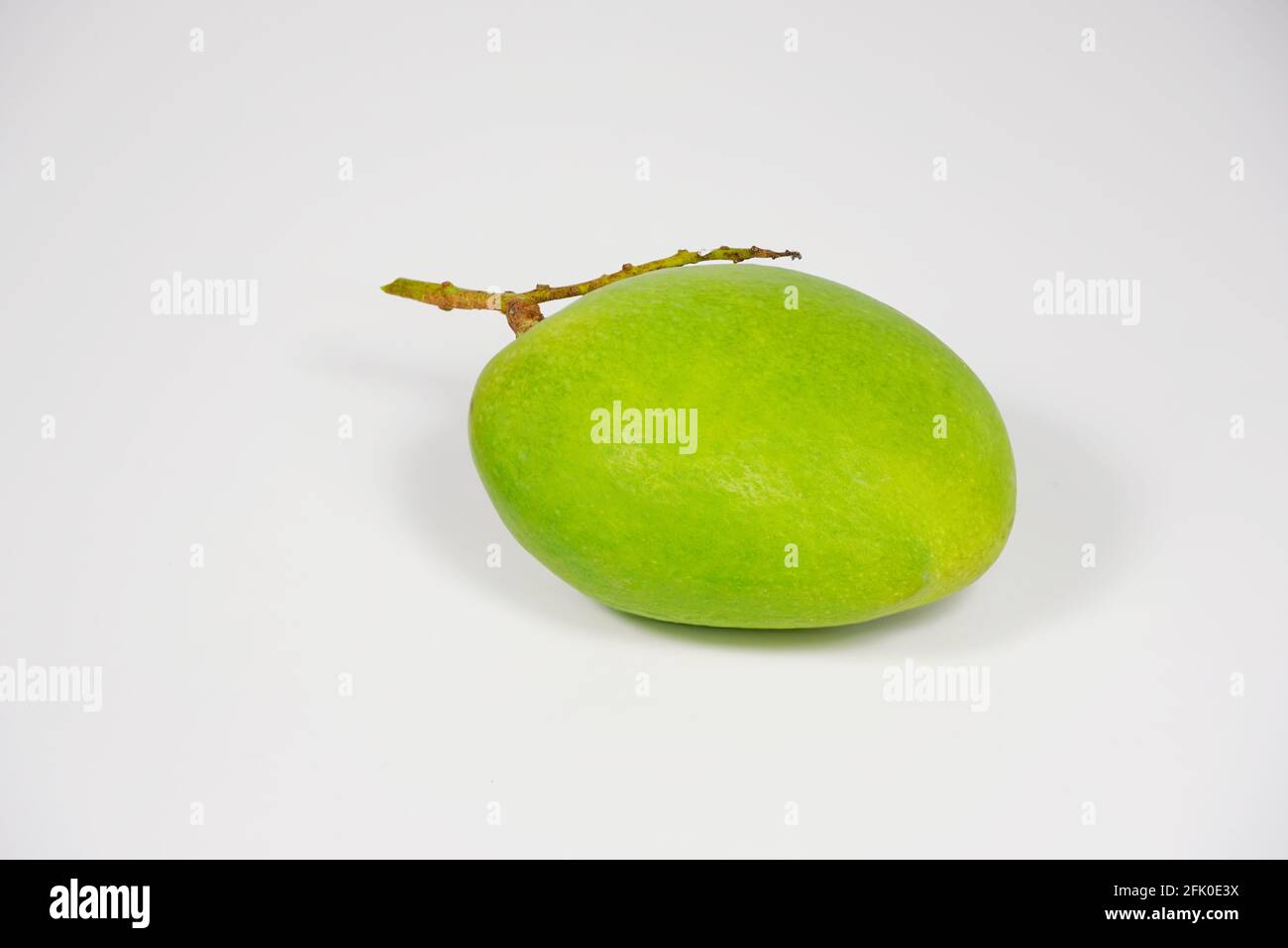 Single of raw green mango isolated on white background Stock Photo