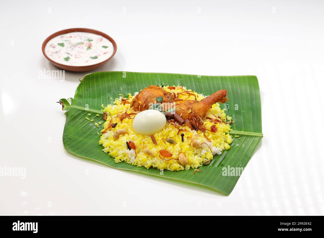 Kerala Chicken dum biryani ,arranged traditionally in a banana leaf and
