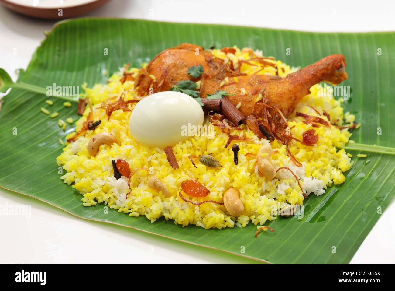 Kerala Chicken dum biryani ,arranged traditionally in a banana leaf and