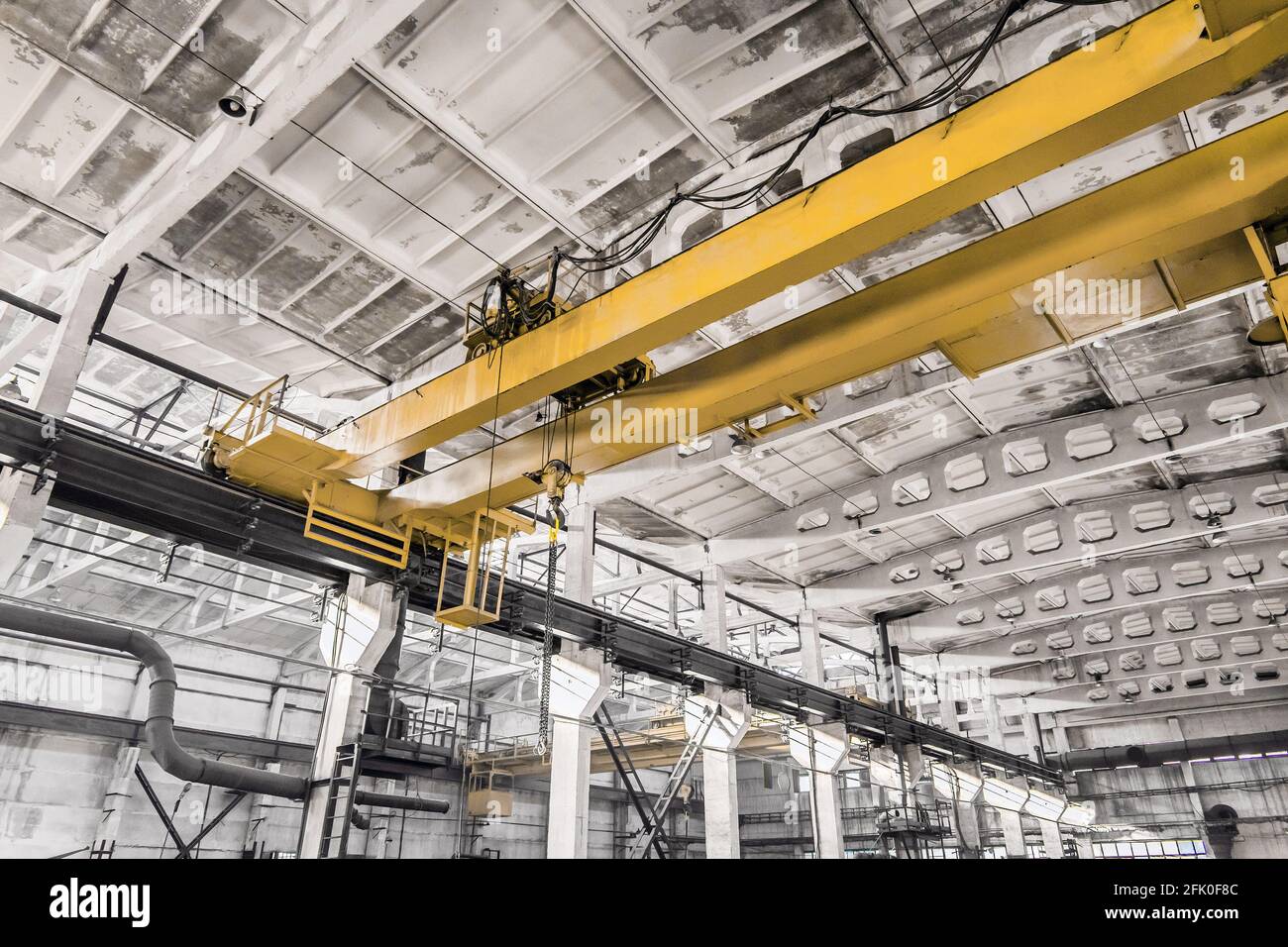 Overhead construction equipment crane in an industrial plant