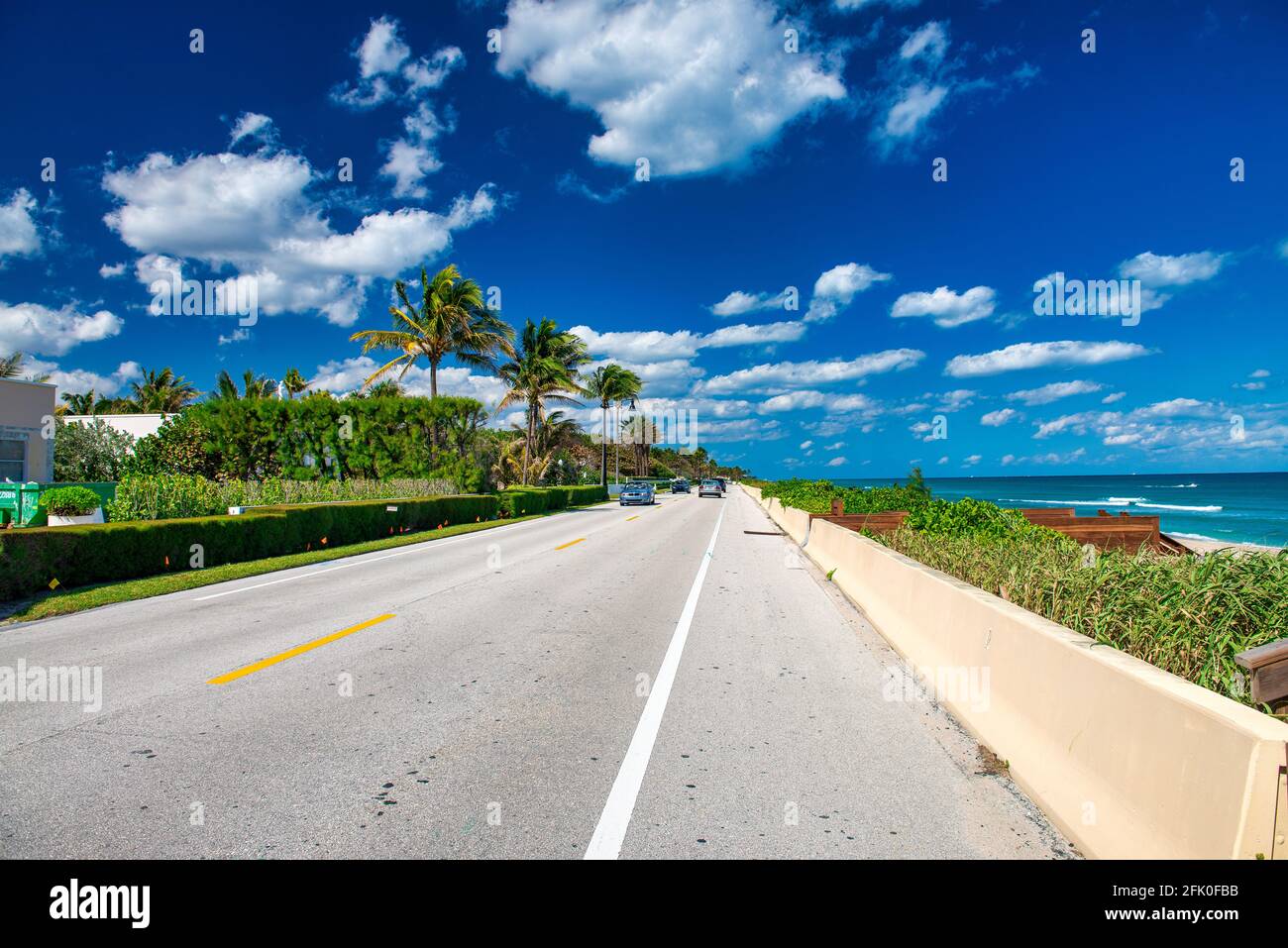 PALM BEACH, FL - FEBRUARY 2016: City traffic on a sunny day along the ocean. Stock Photo