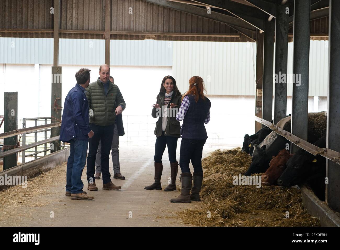 The Duke and Duchess of Cambridge (centre) are shown cattle by farmers