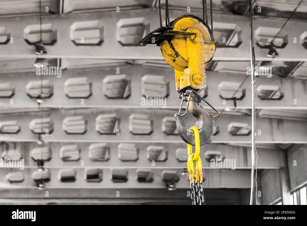 Overhead crane lifting hook on the background of an industrial