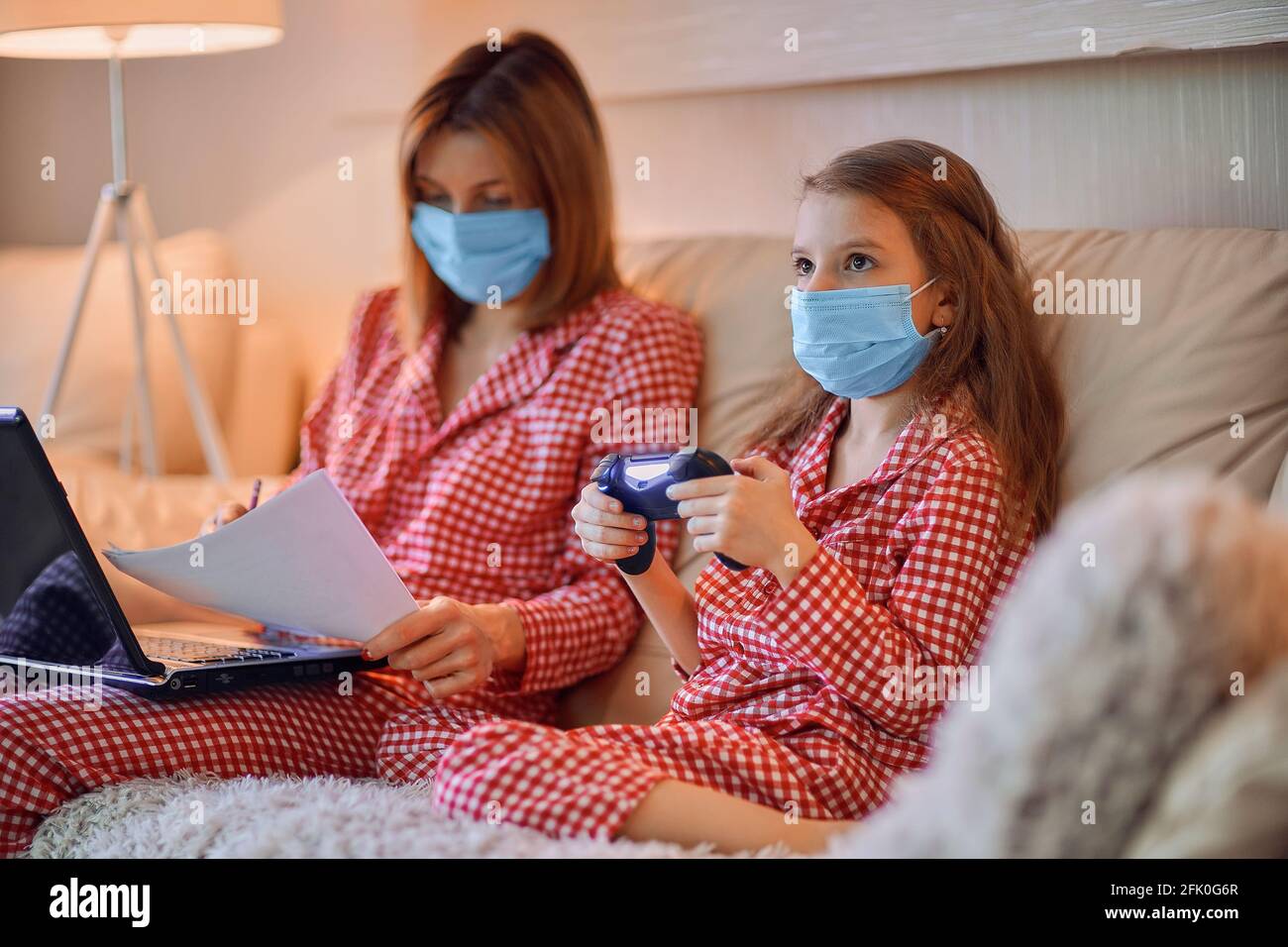 Working In Pyjamas Woman in pajamas with notebook and papers working from home wear Stock ...