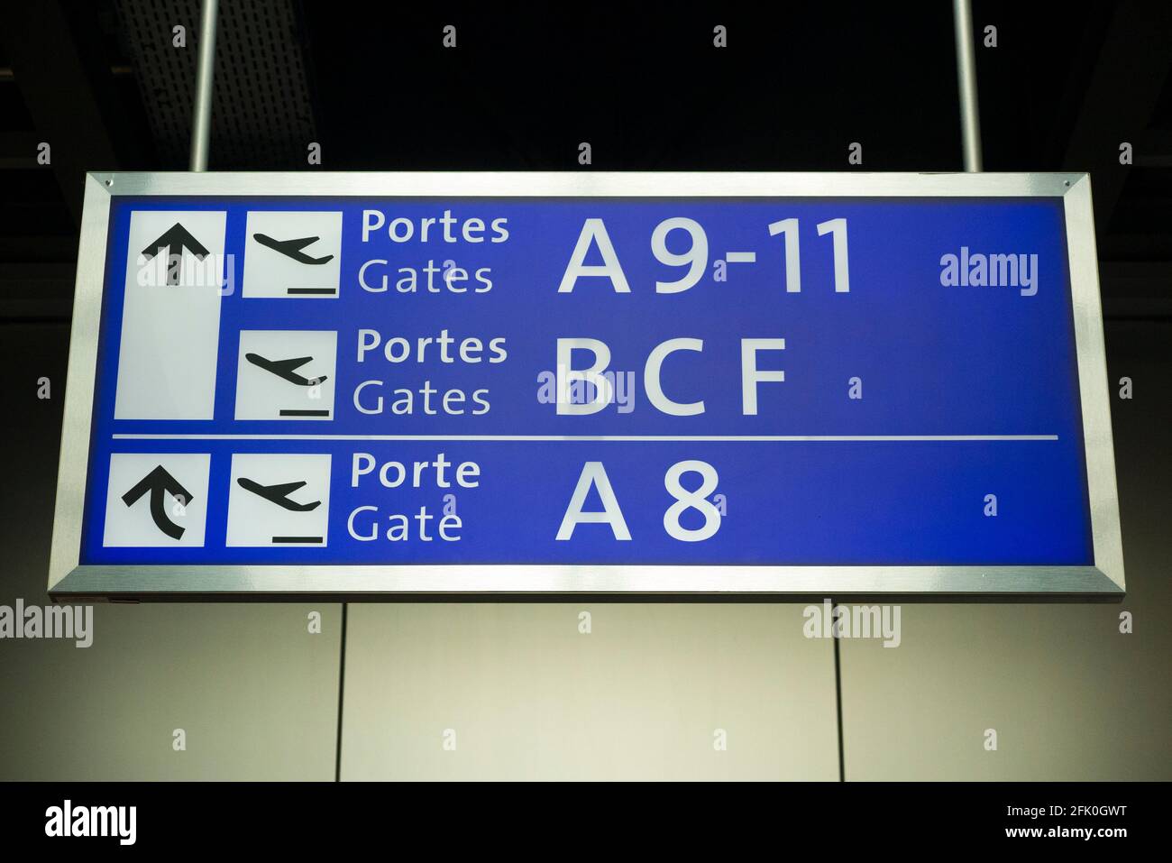 Sign board / screen indicating departure gates departing flights, in the departure lounge of at