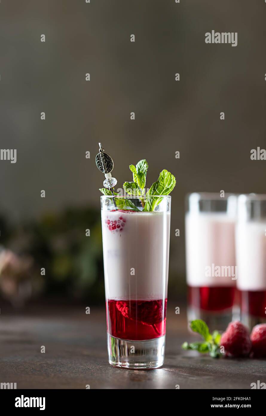 Shot cocktails with raspberry, vanilla liqour, vodka. Fresh summer ...