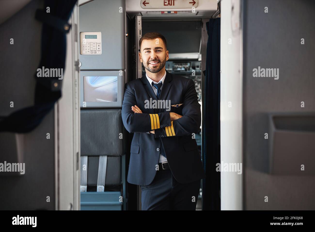Well Rested Pilots Handsome friendly young pilot having rest after the flight Stock Photo ...