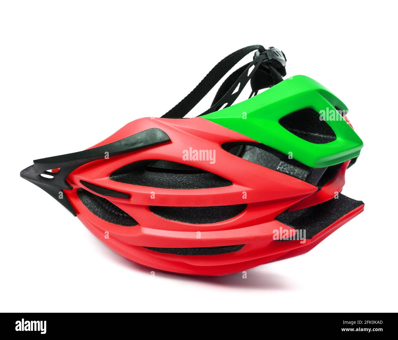 Red and green bicycle helmet upsidedown isolated on white background