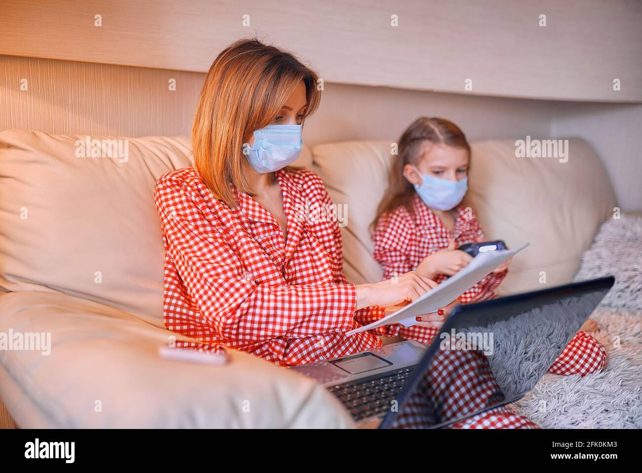 Working In Pyjamas Woman in pajamas with notebook and papers working from home wear Stock ...