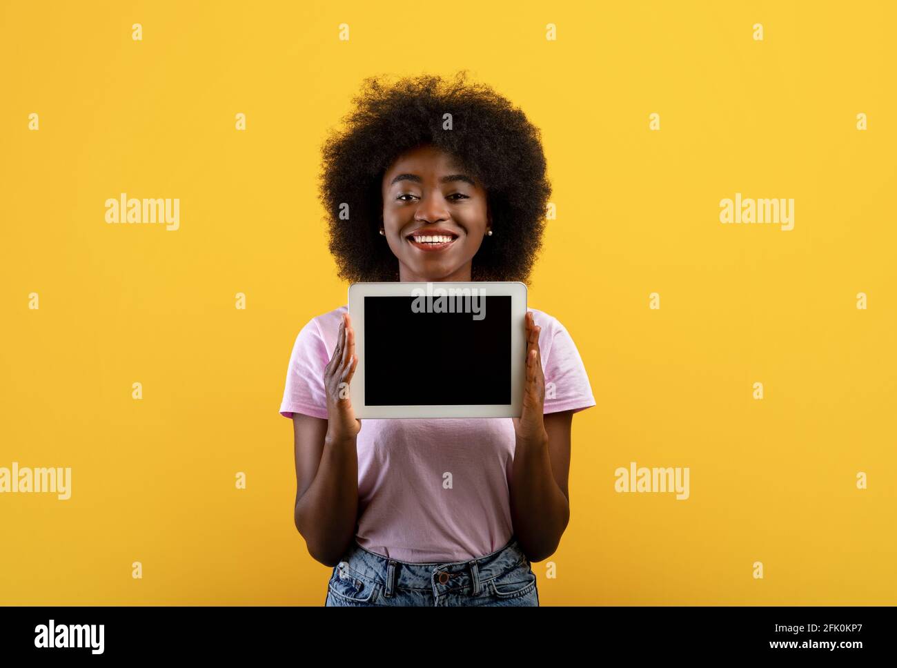 African american lady demonstrating digital tablet with empty screen ...