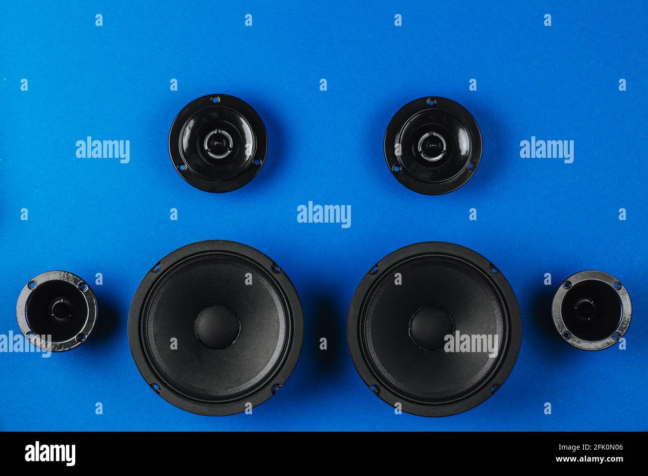Car audio system. A set of speakers on a blue background. Stock Photo
