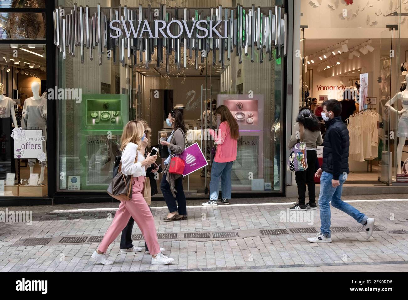Athens, Greece. 27th Apr, 2021. People seen walking past a Swarovski store  at Ermou street close to Syntagma square. Credit: Nikolas Joao  Kokovlis/SOPA Images/ZUMA Wire/Alamy Live News Stock Photo - Alamy