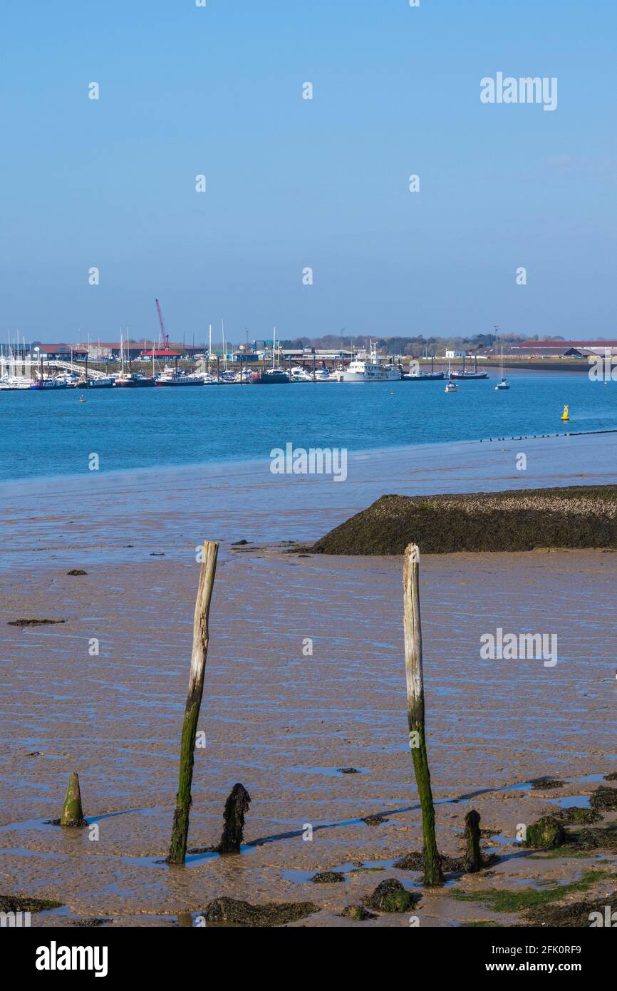Low Tide at Burnham-on-Crouch Looking Across River Crouch to Moored Boats at Baltic Wharf at Canewdon Stock Photo