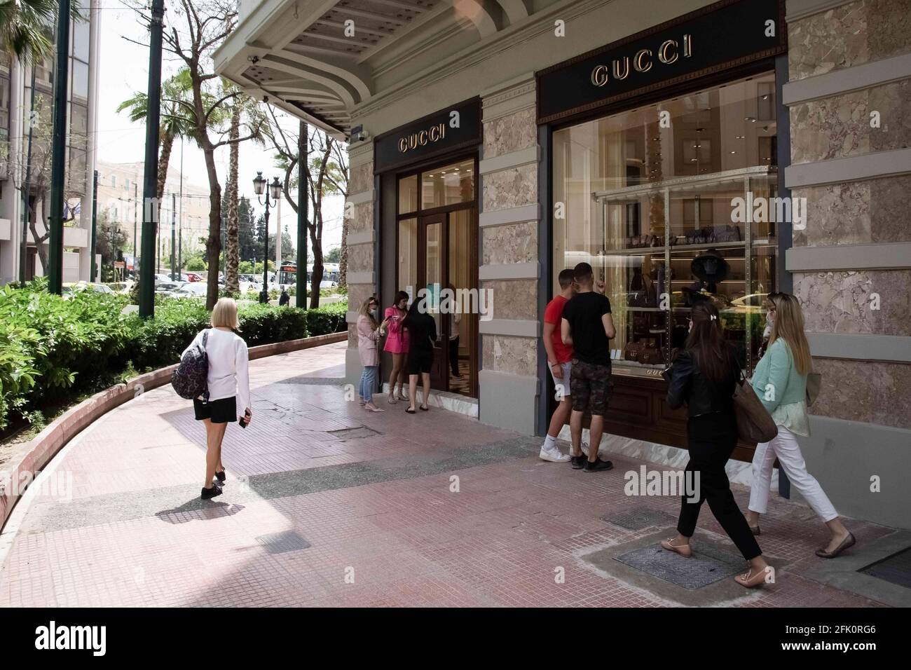 Athens, Greece. 27th Apr, 2021. People seen walking past a Gucci store  close to Syntagma square. Credit: Nikolas Joao Kokovlis/SOPA Images/ZUMA  Wire/Alamy Live News Stock Photo - Alamy