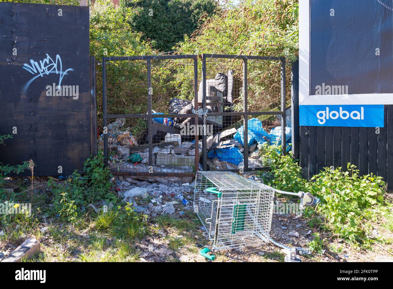 Rubbish dumped by gates in Bradford Street in Digbeth, Birmingham,UK Stock Photo