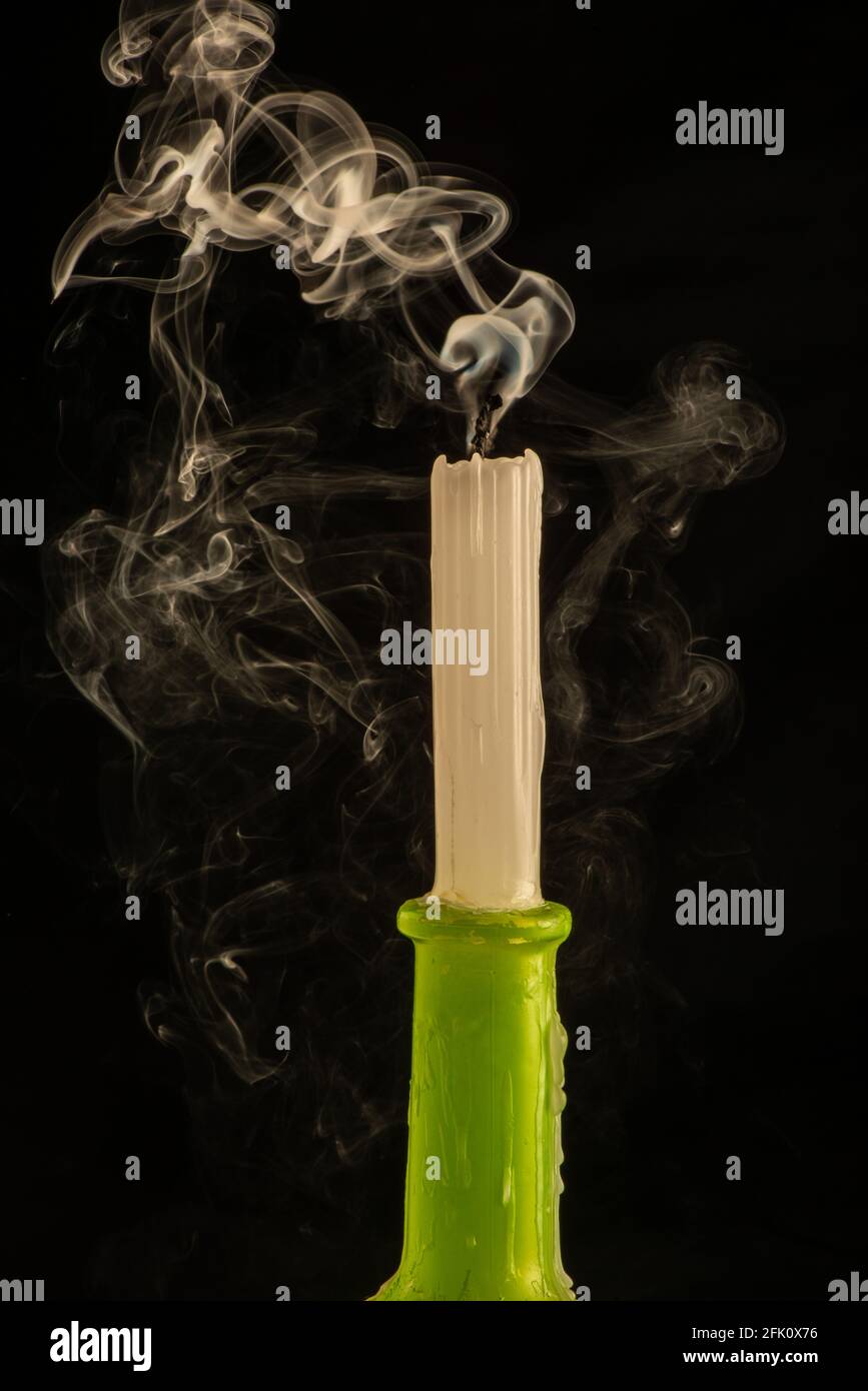 Single candle on black background smoke Stock Photo Alamy
