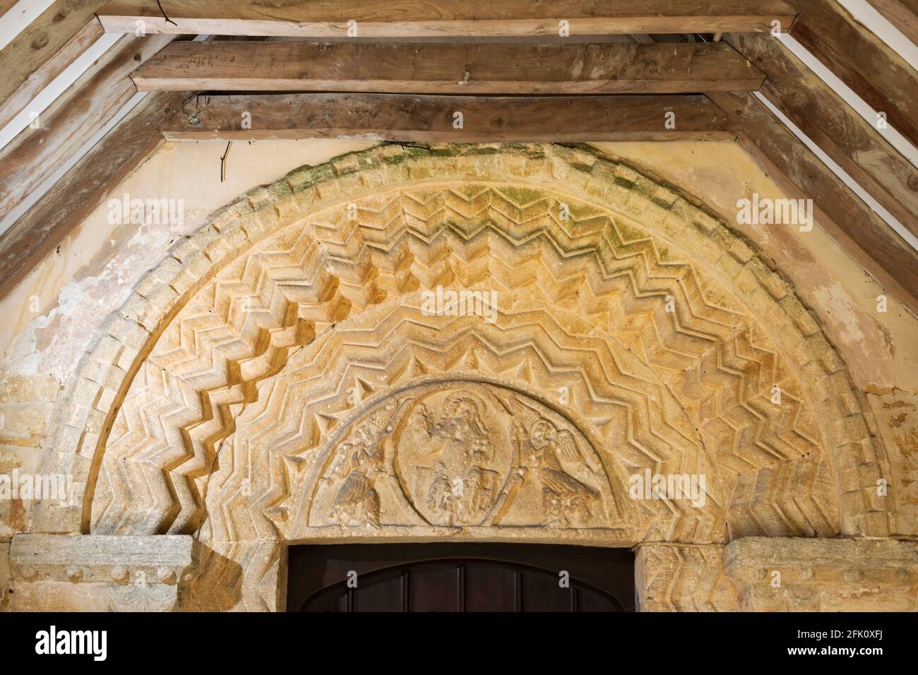 Carved arch over the door of St Andrews Church, Eastleach, Cotswolds, Gloucestershire, England, United Kingdom, Europe Stock Photo