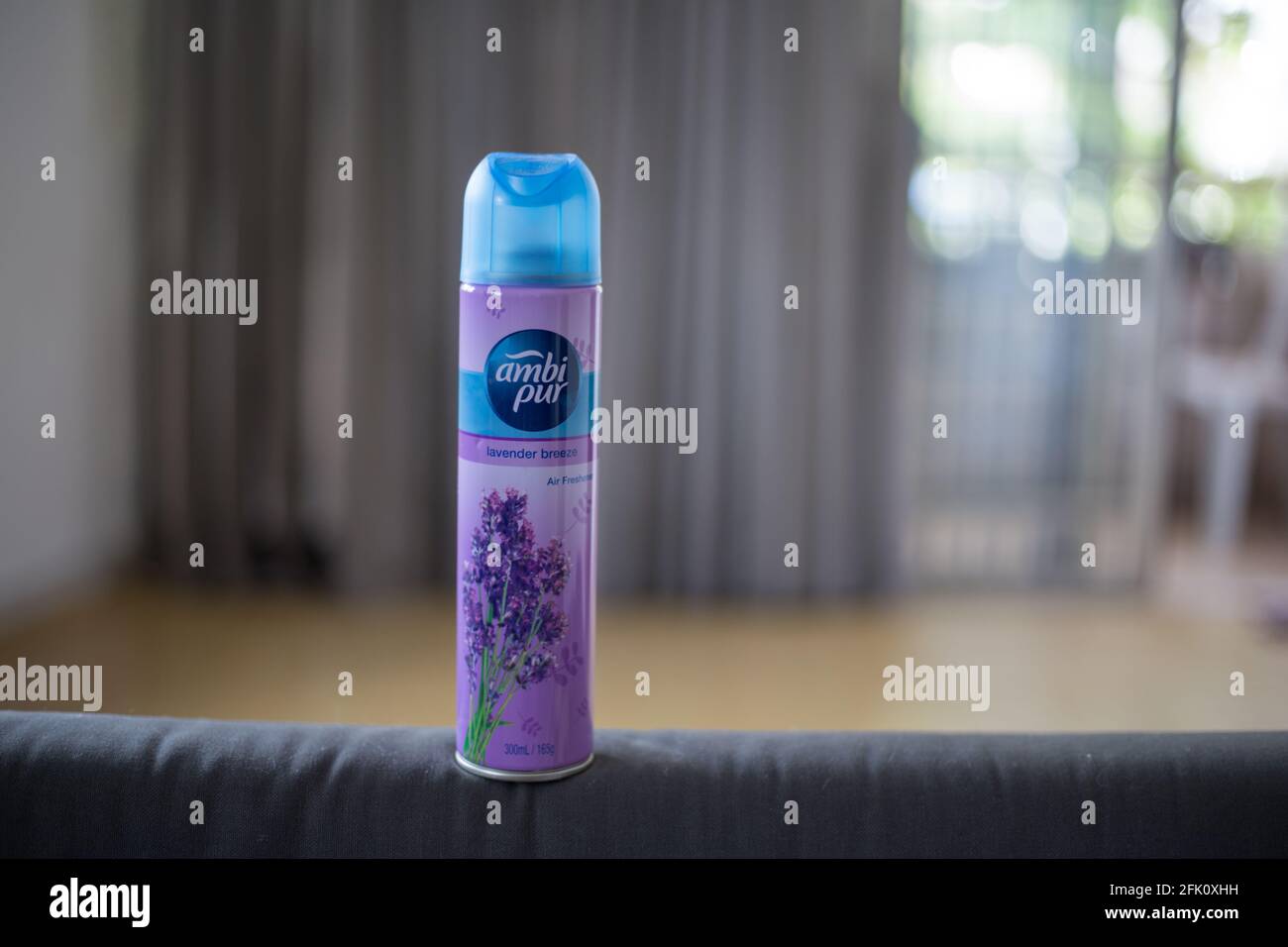 KUALA LUMPUR, MALAYSIA - Apr 25, 2021: Lavender breeze air freshener spray bottle isolated on blurry background. housekeeping essential air freshener. Stock Photo