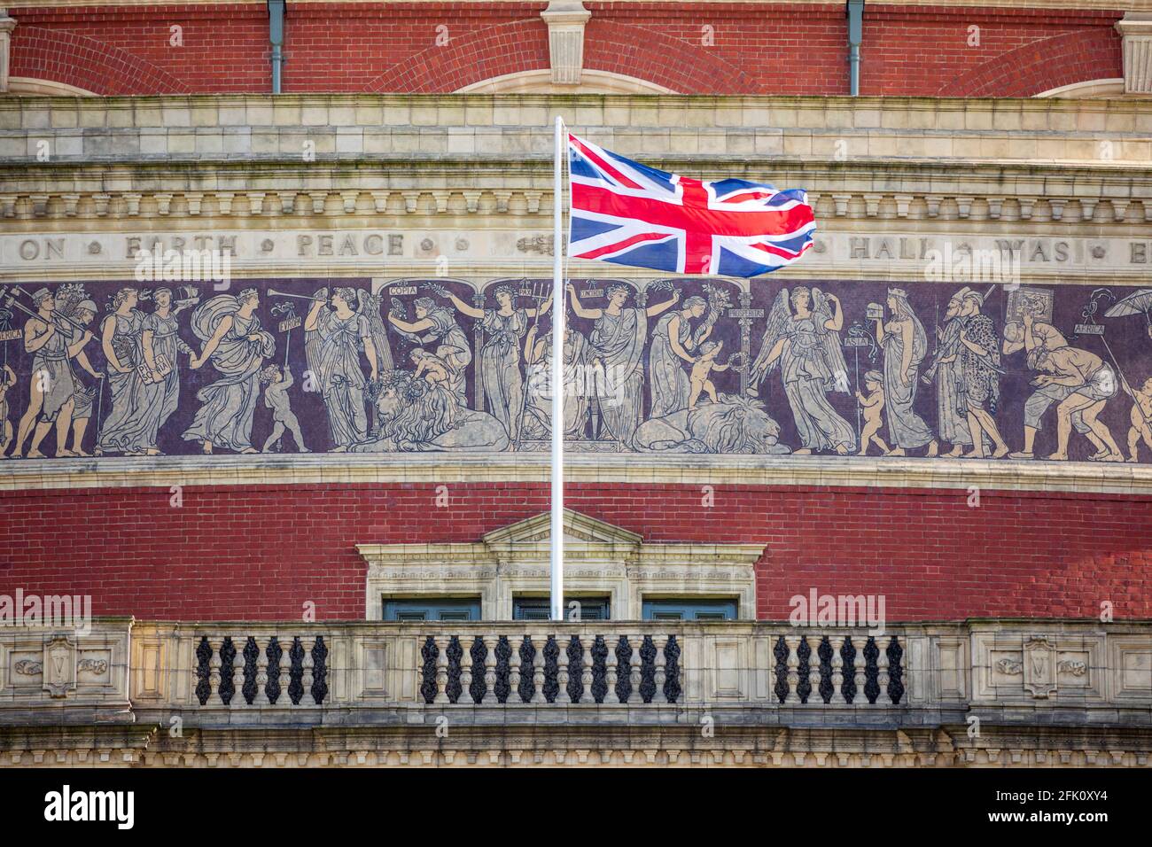 Union Jack flag flying on exterior of the Royal Albert Hall viewed from the Albert Memorial, Kensington, London, United Kingdom, Europe Stock Photo